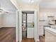 Stacked washer and dryer tucked neatly behind closet doors at 107 S Laurel Ave # 101A, Charlotte, NC 28207