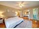 Comfortable bedroom with hardwood floors, sliding mirror closet, and natural light at 1115 Kelly Rd, Mount Holly, NC 28120