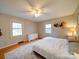 Inviting bedroom with hardwood floors, large windows, and ceiling fan at 1115 Kelly Rd, Mount Holly, NC 28120