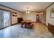 Open dining area featuring wood accents, fireplace and view of the backyard through glass door at 1115 Kelly Rd, Mount Holly, NC 28120