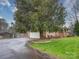 Ranch home featuring an attached garage and mature landscaping at 1115 Kelly Rd, Mount Holly, NC 28120