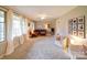 Cozy living room with neutral carpet, ample natural light, and a comfortable seating arrangement at 1115 Kelly Rd, Mount Holly, NC 28120