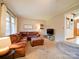 Comfortable living room with a large sectional sofa and a seamless transition to other areas of the home at 1115 Kelly Rd, Mount Holly, NC 28120
