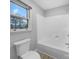 Clean and functional bathroom features a shower-tub combo and a window for natural light at 1125 Twin Lakes Rd, Rock Hill, SC 29732