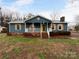 Charming single-story home features a welcoming front porch, shutters, and a beautifully maintained lawn at 1125 Twin Lakes Rd, Rock Hill, SC 29732