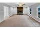 Open-concept living room featuring fireplace and natural light at 1125 Twin Lakes Rd, Rock Hill, SC 29732