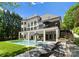 Beautiful backyard with a sparkling pool, lounge area, and lush greenery at 12014 James Jack Ln, Charlotte, NC 28277