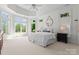 Spacious bedroom featuring large windows and a king-size bed at 12014 James Jack Ln, Charlotte, NC 28277