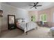 Bright bedroom with wallpaper, comfortable bed, and natural light at 12014 James Jack Ln, Charlotte, NC 28277