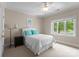 Comfortable bedroom with natural light and a full-sized bed at 12014 James Jack Ln, Charlotte, NC 28277