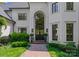 Elegant front entrance featuring a brick walkway, arched doorway and beautiful landscaping at 12014 James Jack Ln, Charlotte, NC 28277