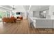Open-concept living space with a fireplace, a large island with seating, and a comfortable seating area at 12014 James Jack Ln, Charlotte, NC 28277