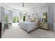 Spacious main bedroom featuring a bay window, decorative ceiling, neutral colors, and plush carpeting at 12014 James Jack Ln, Charlotte, NC 28277