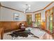 Home office featuring wood paneling, natural light, and a modern light fixture at 12014 James Jack Ln, Charlotte, NC 28277