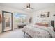 Comfortable bedroom features a large window, a ceiling fan, and carpet flooring at 129 Doncaster Dr, Mooresville, NC 28115