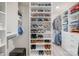 Organized walk-in closet with ample shoe storage and clothing racks, maximizing space and convenience at 129 Doncaster Dr, Mooresville, NC 28115