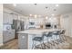 Spacious kitchen showcases a center island, stainless appliances, and sleek pendant lights at 129 Doncaster Dr, Mooresville, NC 28115