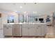 Kitchen island offering counter seating overlooks a cozy living area at 129 Doncaster Dr, Mooresville, NC 28115