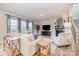 Spacious living room with a fireplace, large windows, comfortable seating, and modern decor at 129 Doncaster Dr, Mooresville, NC 28115