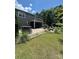 Great backyard with brick patio, bar with stools, Adirondack chairs, fire pit and screened in porch at 13240 Carolina Wren Ct, Charlotte, NC 28278