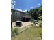 Backyard with outdoor bar, fire pit, and screened in porch at 13240 Carolina Wren Ct, Charlotte, NC 28278