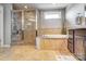 Bathroom features glass shower and soaking tub with granite counter at 13240 Carolina Wren Ct, Charlotte, NC 28278