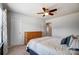 Bright bedroom featuring neutral walls, ceiling fan, and closet door at 13240 Carolina Wren Ct, Charlotte, NC 28278