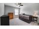 Comfortable bedroom features a ceiling fan and carpeted floors at 13240 Carolina Wren Ct, Charlotte, NC 28278