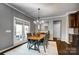 Cozy dining room with stylish chandelier and access to the outdoor patio at 13240 Carolina Wren Ct, Charlotte, NC 28278