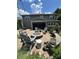Cozy backyard fire pit with Adirondack chairs, perfect for entertaining and relaxing outdoors at 13240 Carolina Wren Ct, Charlotte, NC 28278