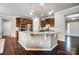 Well-equipped kitchen with stainless steel appliances and center island with granite countertop at 13240 Carolina Wren Ct, Charlotte, NC 28278