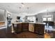 Modern kitchen with stainless steel appliances, center island and hardwood floors at 13240 Carolina Wren Ct, Charlotte, NC 28278