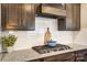 Well-equipped kitchen features dark wood cabinetry and a granite countertop at 13240 Carolina Wren Ct, Charlotte, NC 28278