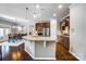 Gourmet kitchen with stainless steel appliances, granite countertops, and eat-in dining area at 13240 Carolina Wren Ct, Charlotte, NC 28278