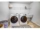 Practical laundry room with modern front-load washer and dryer at 13240 Carolina Wren Ct, Charlotte, NC 28278