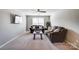 Comfortable living room with neutral colors and a ceiling fan at 13240 Carolina Wren Ct, Charlotte, NC 28278