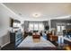 Spacious living room with large windows, dark wood floors, and stylish decor at 13240 Carolina Wren Ct, Charlotte, NC 28278