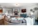 Open-concept living room featuring a stone fireplace, and comfortable seating area at 13240 Carolina Wren Ct, Charlotte, NC 28278