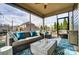 Screened-in porch featuring comfortable seating, string lights and a ceiling fan at 13240 Carolina Wren Ct, Charlotte, NC 28278