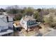 Aerial shot showcasing the historic home, its porch, yard, and surrounding greenery in the neighborhood at 143 Reid St, Rock Hill, SC 29730