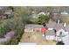 Aerial view displays the home nestled in a neighborhood with lush greenery and nearby houses at 143 Reid St, Rock Hill, SC 29730