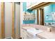 Bathroom with vintage sink and storage shelves at 143 Reid St, Rock Hill, SC 29730