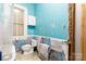 Bathroom with toilet, patterned wallpaper, and window at 143 Reid St, Rock Hill, SC 29730