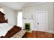 Bedroom with hardwood floors, decorative fireplace, and unique vintage charm at 143 Reid St, Rock Hill, SC 29730