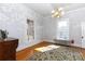 Bright bedroom featuring hardwood floors, large windows, and a vintage radiator, offering natural light at 143 Reid St, Rock Hill, SC 29730