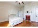 Bedroom featuring hardwood floors, a decorative fireplace, and original architectural details at 143 Reid St, Rock Hill, SC 29730