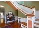 Grand foyer featuring a staircase with a white banister, hardwood floors, and classic architectural details at 143 Reid St, Rock Hill, SC 29730