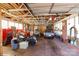 Spacious garage interior with a motorcycle, car, and various tools and equipment at 143 Reid St, Rock Hill, SC 29730