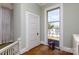 Bright hallway featuring a window, original hardwood floors, and classic architectural details at 143 Reid St, Rock Hill, SC 29730