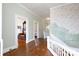 Spacious hallway with hardwood floors, traditional trim, and view into adjacent rooms at 143 Reid St, Rock Hill, SC 29730